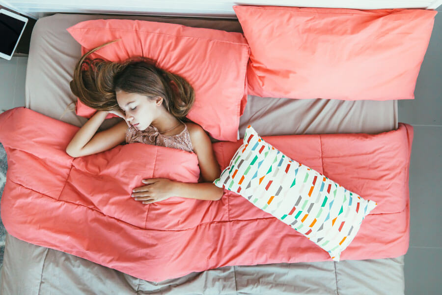 Woman who has trained herself to sleep on her back