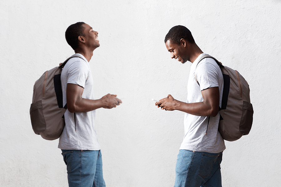 Man demonstrating what good and bad posture looks like