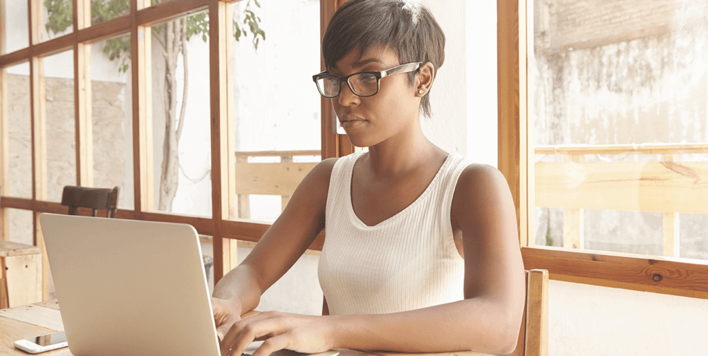 Woman with good posture working on her laptop