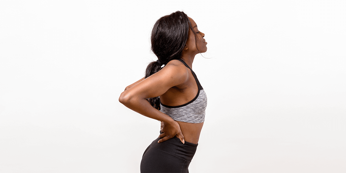 Woman stretching her back for pain relief